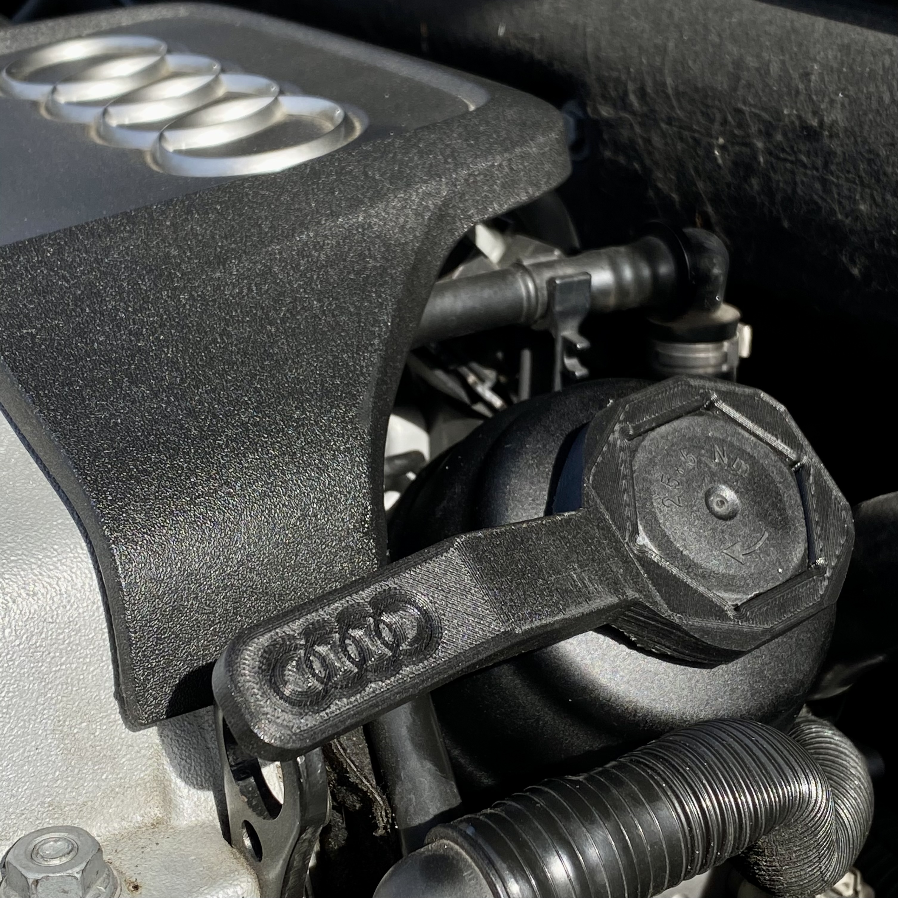 wrench in engine bay